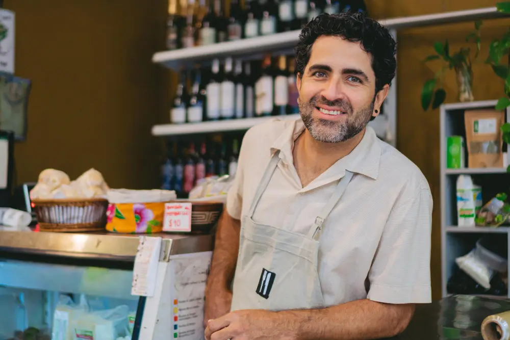local business owner smiling grocery shop Website Maintenance